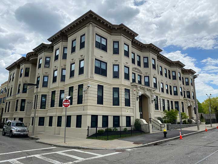 Beautiful four story white stone building.